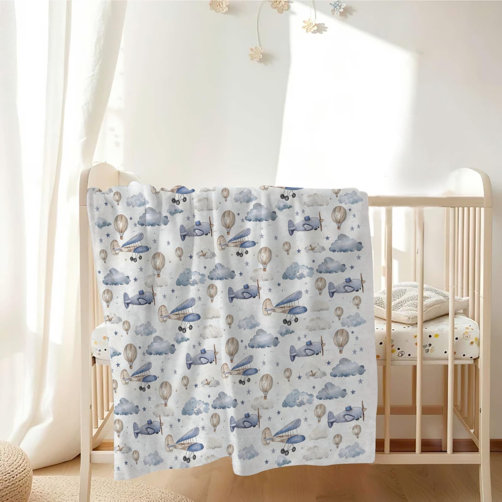 KuphiL10C multiuse blanket doubles as a nursing cover for privacy.