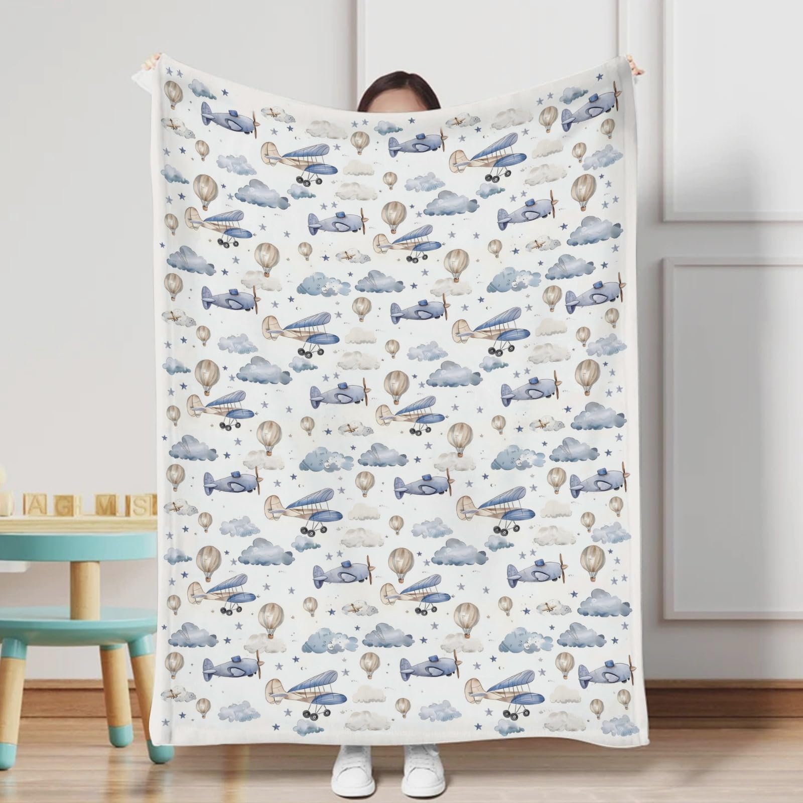 KuphiL10C nursery with clouds and stars pattern enhances dreamy decor.
