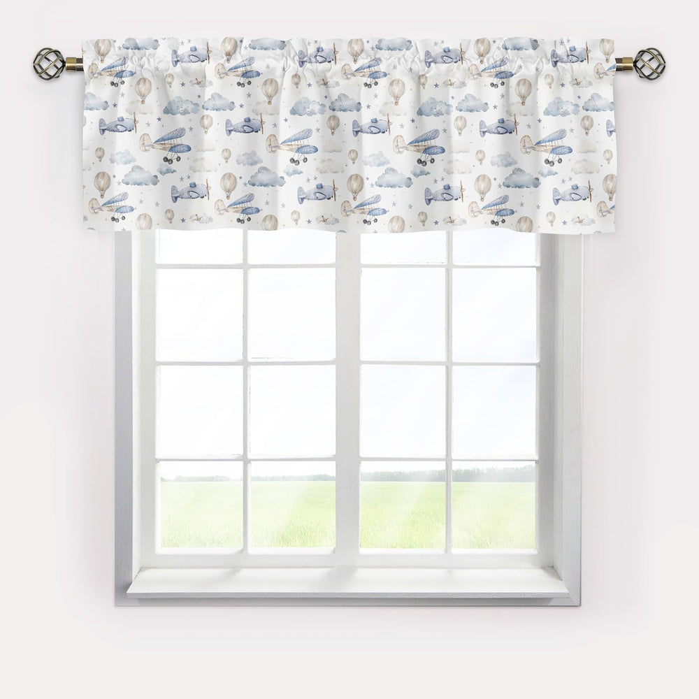KuphiL10C valance with clouds and stars brightens nursery while filtering glare.