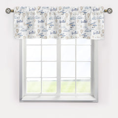 KuphiL10C valance with clouds and stars brightens nursery while filtering glare.