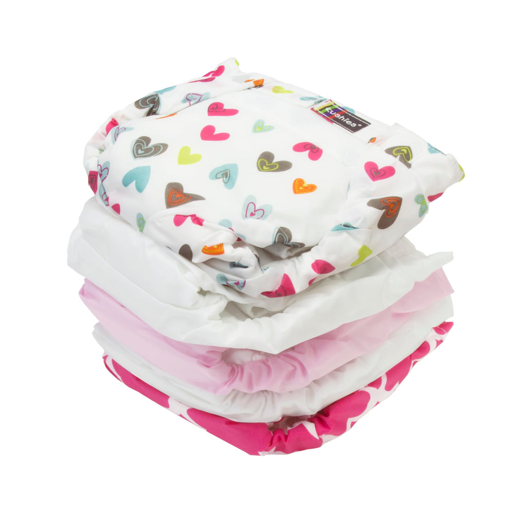 Kushies diaper flap detail showing adjustable absorbency for gender-specific fit.