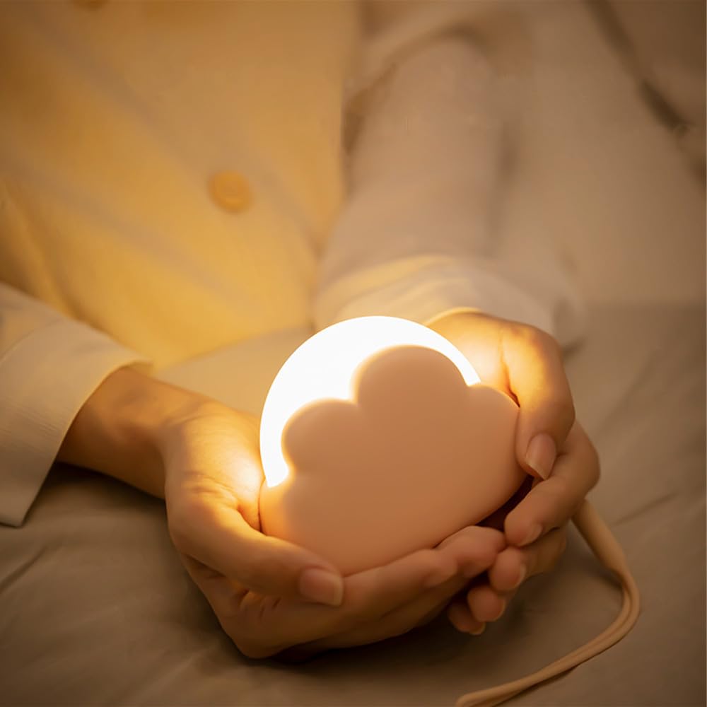 Kvensin cloud night light on bedside table providing soft, safe illumination for nightly routines.