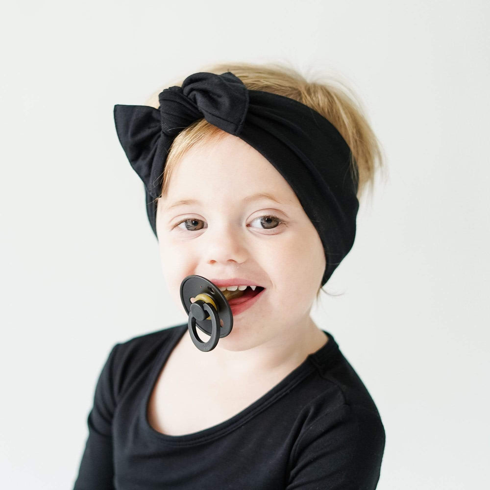 KYTE BABY bamboo bow midnight on baby outfit for cute comfort