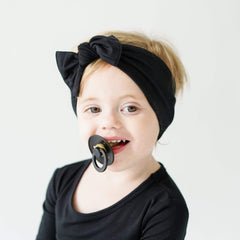 KYTE BABY bamboo bow midnight on baby outfit for cute comfort