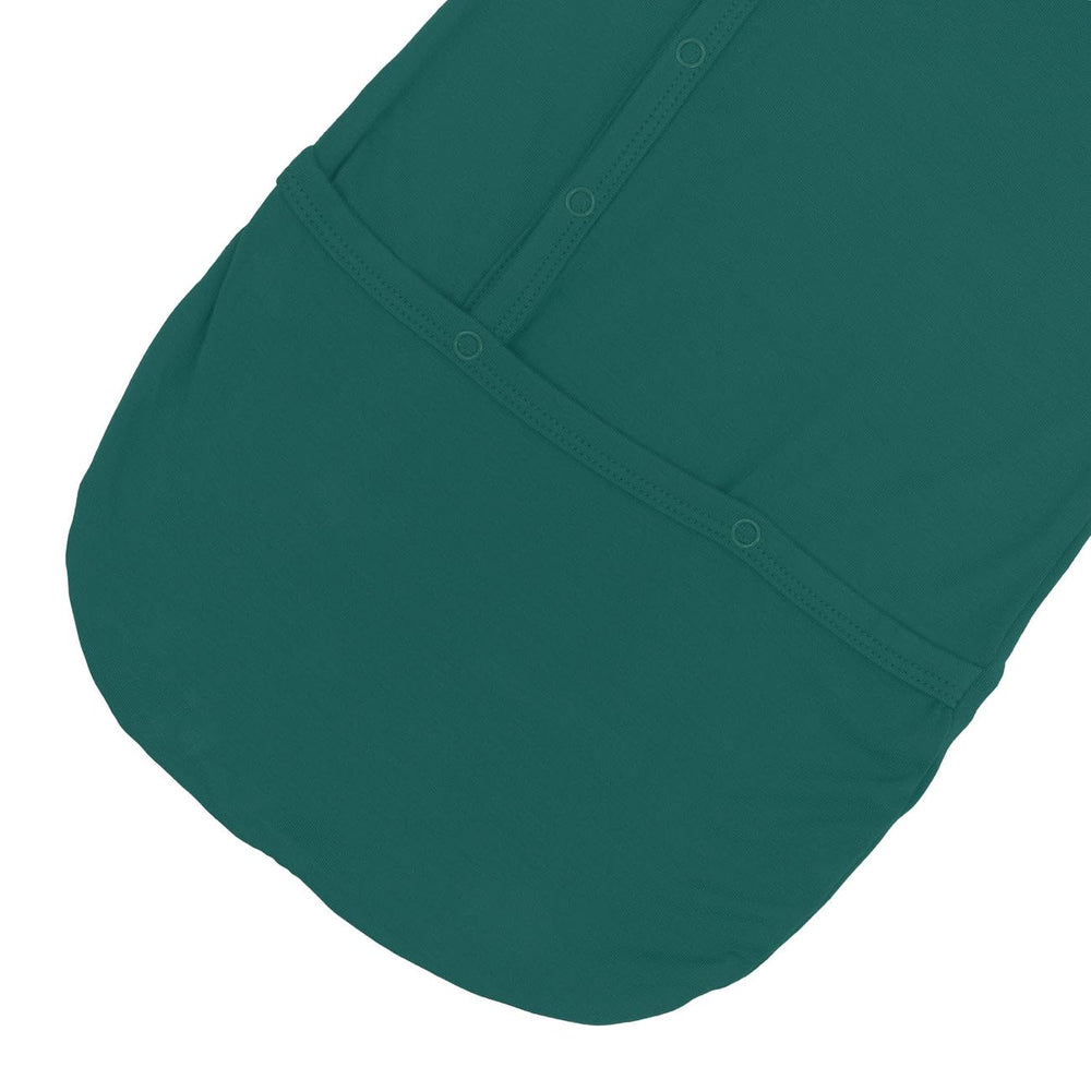 KYTE BABY Bundlers emerald bamboo blend supports sensitive skin during naps.