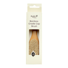 Kyte Baby cradle cap brush with goat hair bristles for gentle scalp massage.