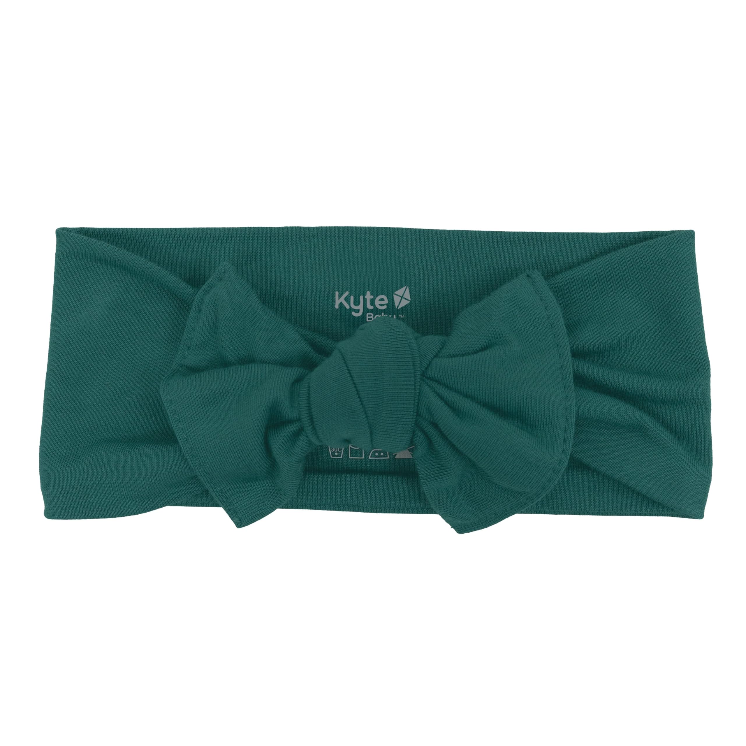 KYTE BABY rayon bamboo bow emerald on baby outfit for gentle support and secure fit.