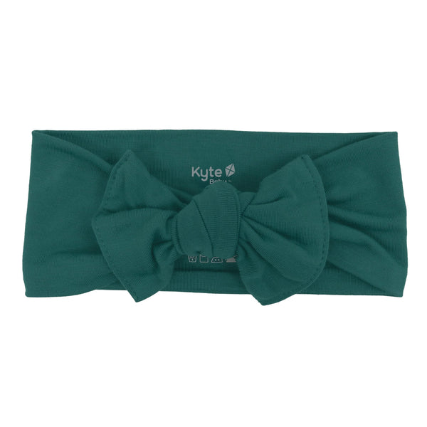 KYTE BABY rayon bamboo bow emerald on baby outfit for gentle support and secure fit.