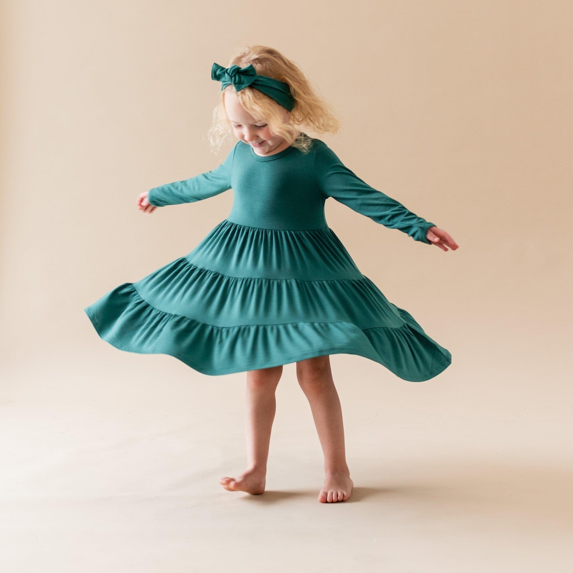 KYTE BABY bamboo bow emerald shows adjustable tie for just-right fit and comfort.