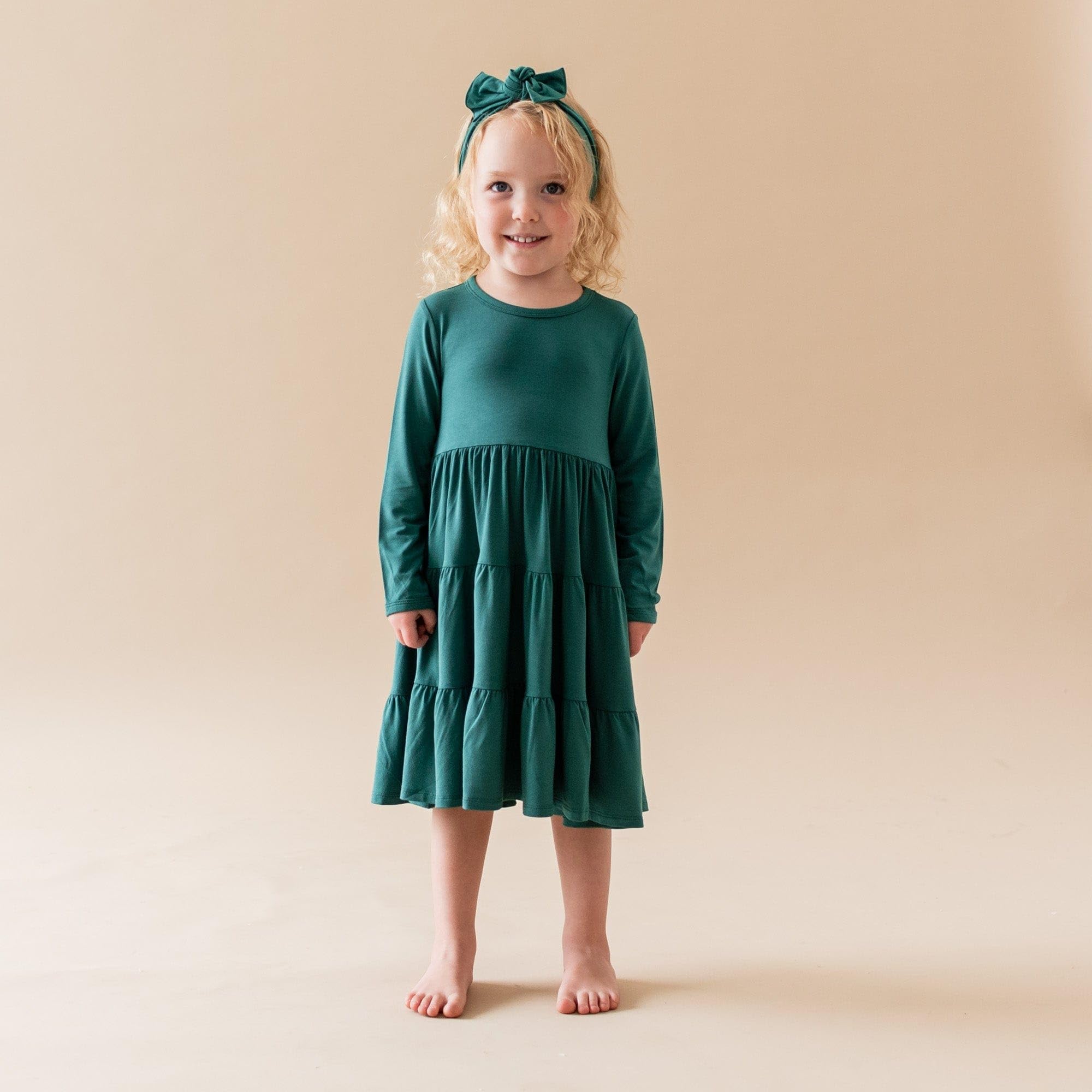 KYTE BABY emerald bow on soft fabric ideal for sensitive skin outfits.