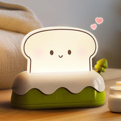 L LOHAS LED cute toaster night light creates warm bedside ambience.