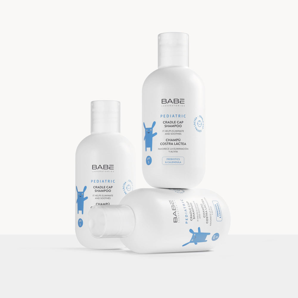 Close-up of Laboratorios Babe cradle cap shampoo showing foaming lather for easy application.