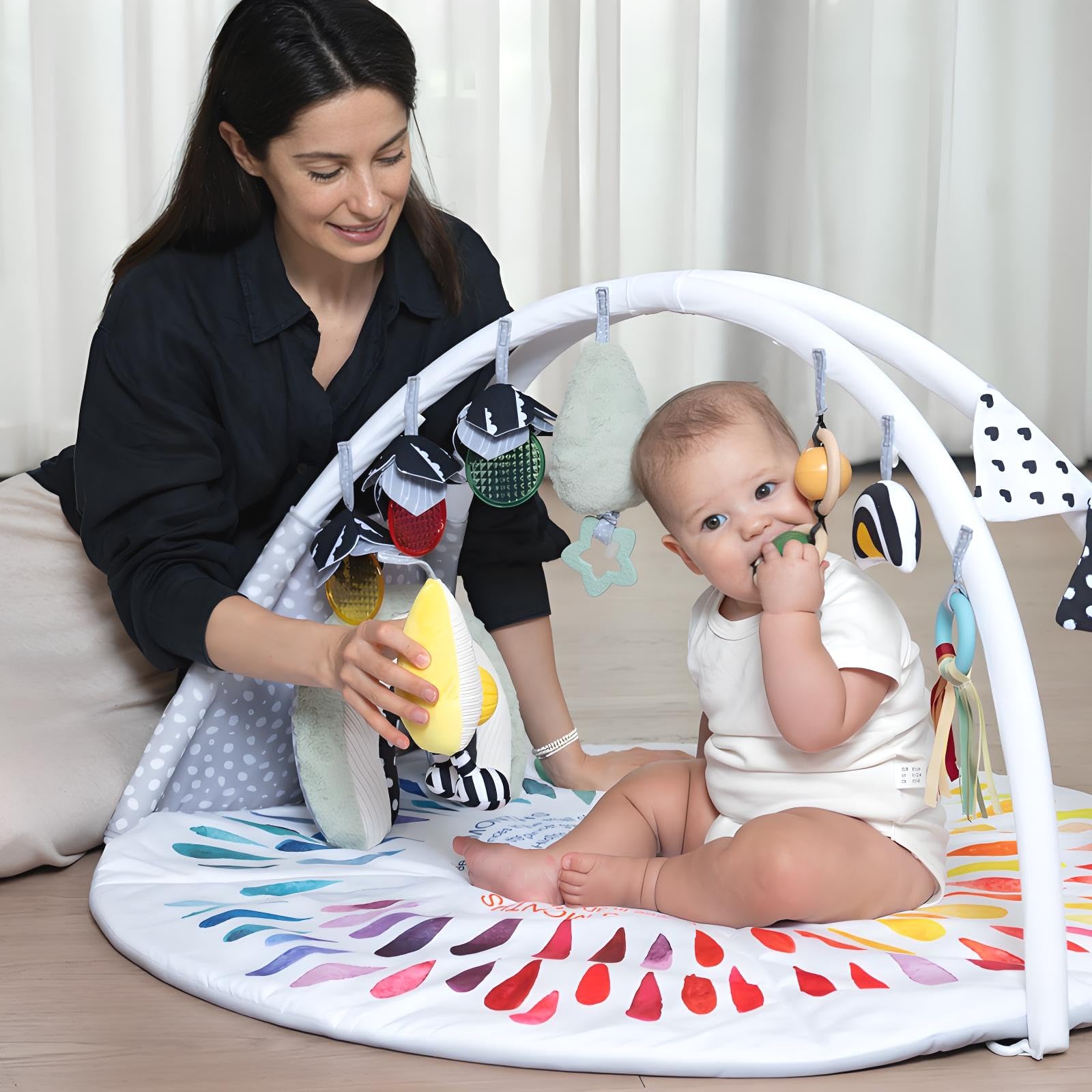 LADIDA crinkle, rattle, and jingle toys for cause-and-effect learning.