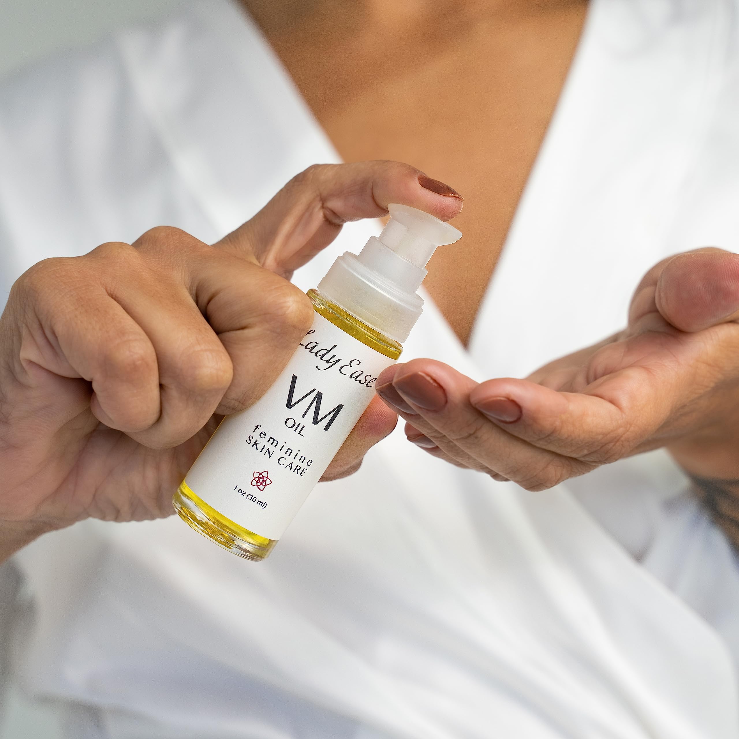 Lady Ease Organic Vaginal Oil dropper being used for gentle application.