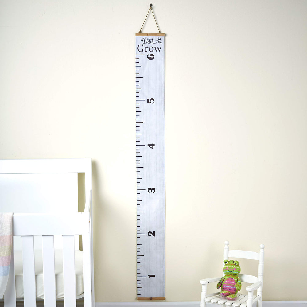 Watch Me Grow growth chart on the wall in a bright bedroom setting