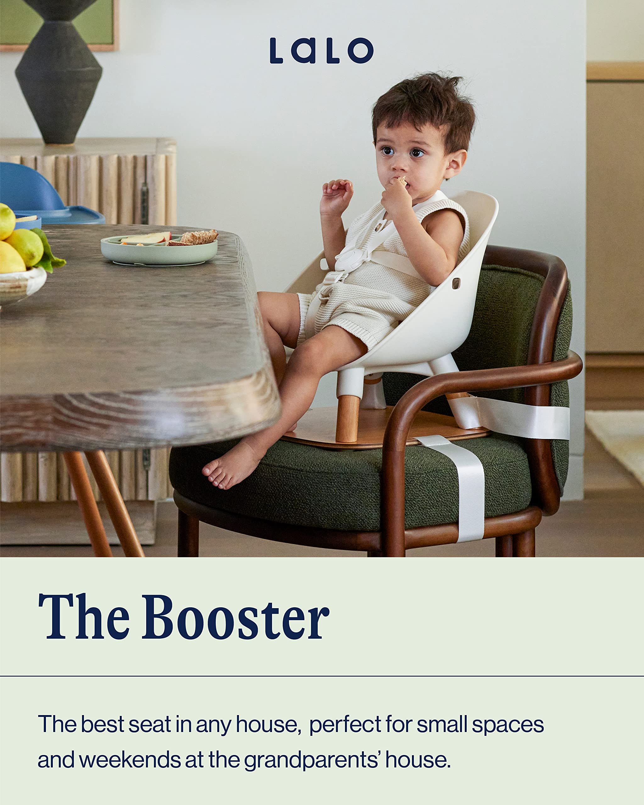 Lalo Booster Seat Coconut harness demonstrates five-point safety for toddlers.