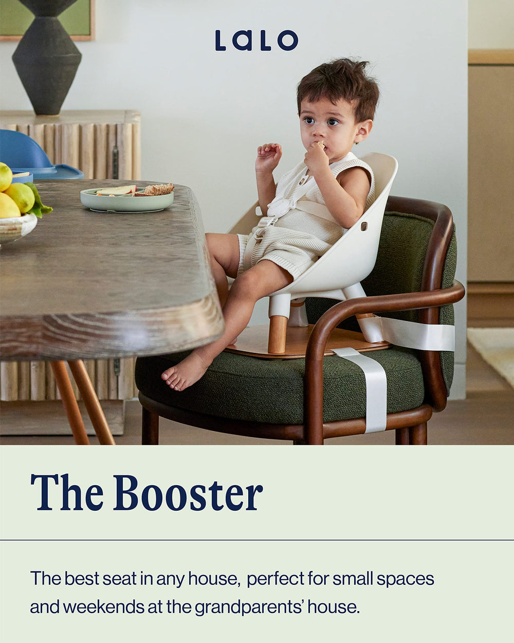 Lalo Booster Seat Coconut harness demonstrates five-point safety for toddlers.