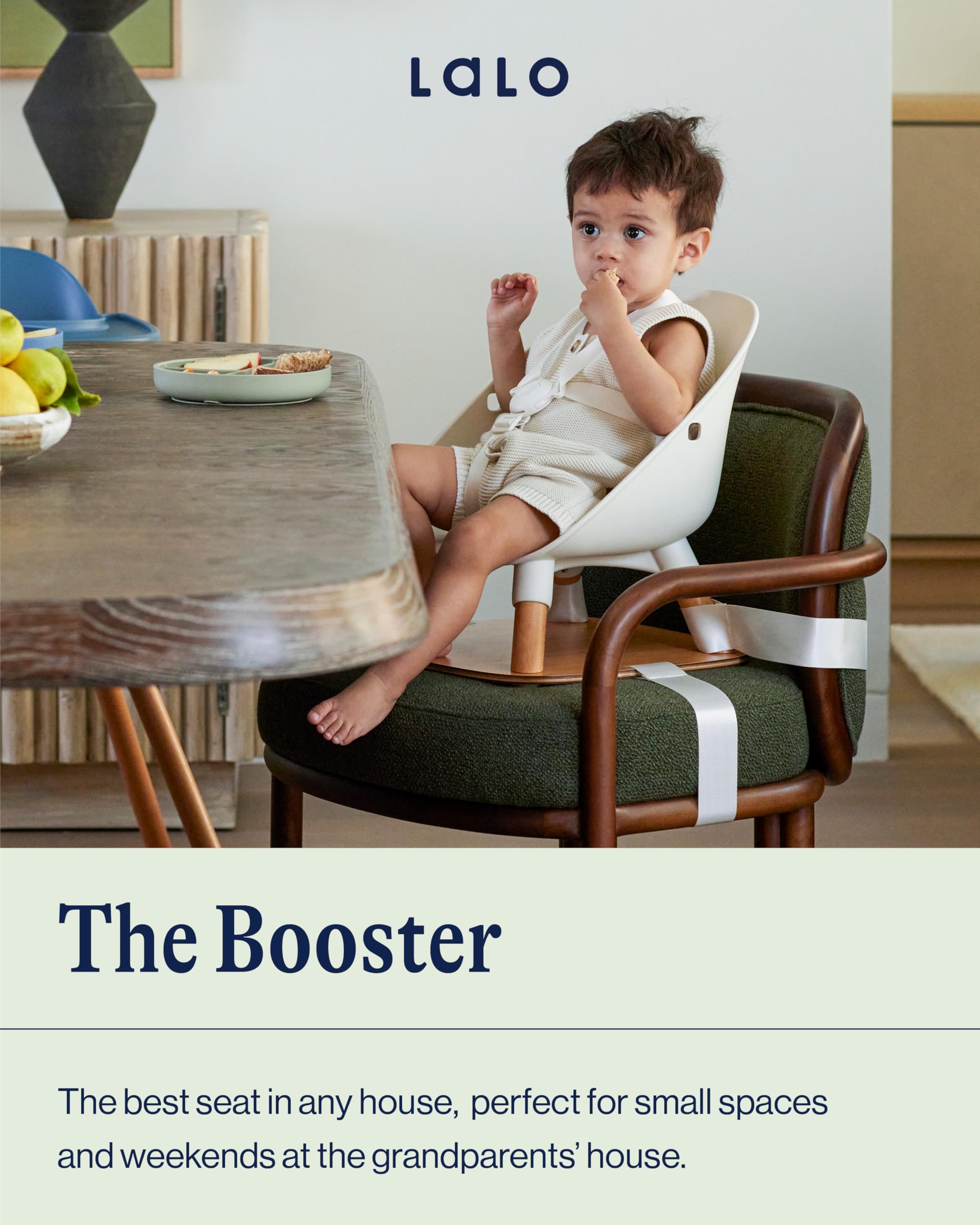 Lalo booster seat Grapefruit, side view showing chair attachment compatibility