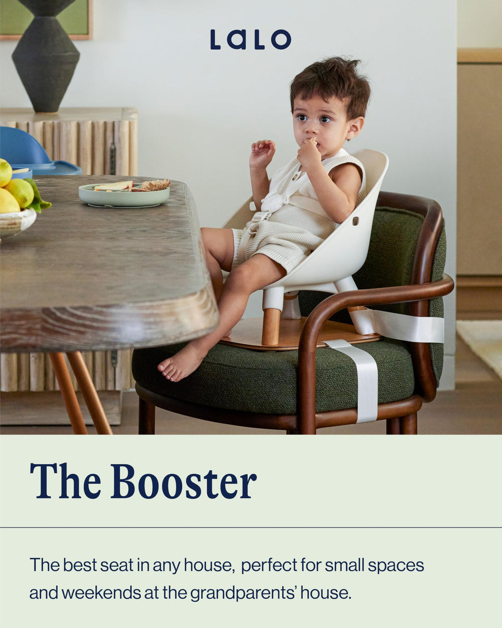 Lalo booster seat Grapefruit, side view showing chair attachment compatibility