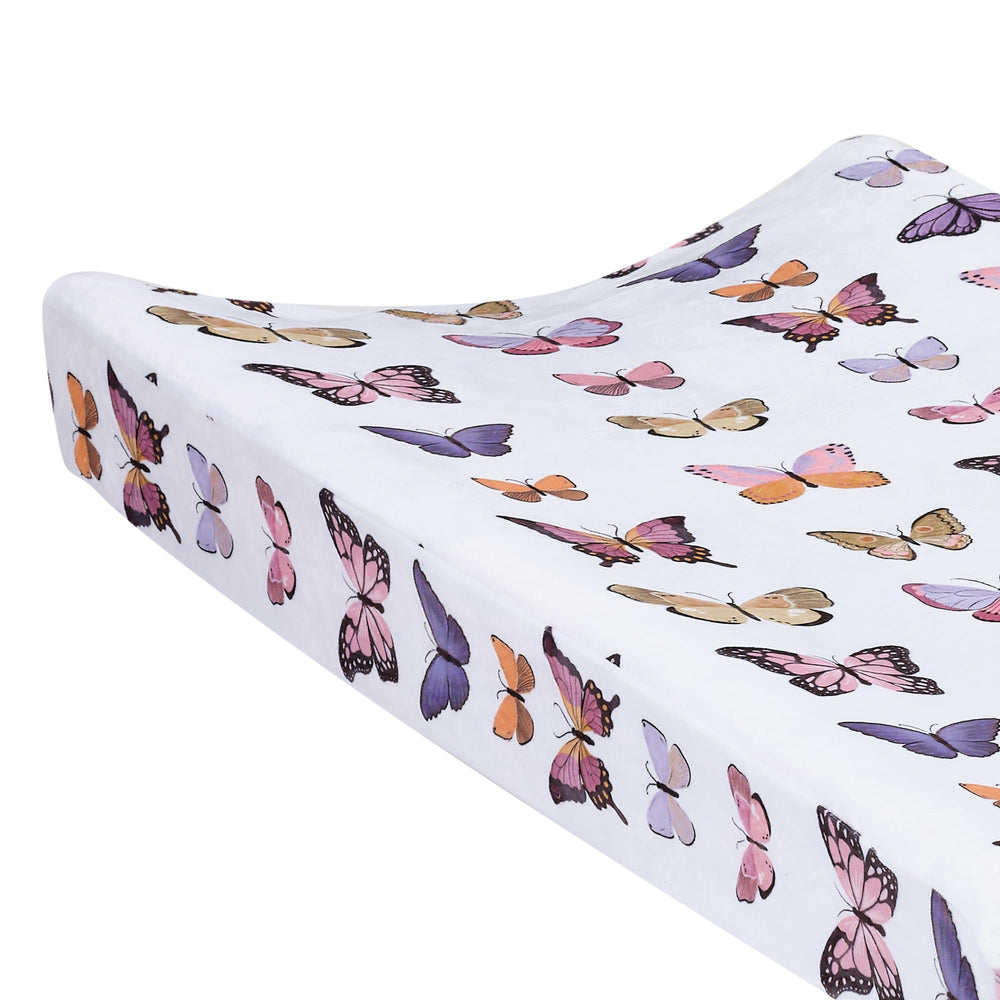 Lambs & Ivy Butterfly Dreams elastic sides secure on standard changing pads for snug fit.