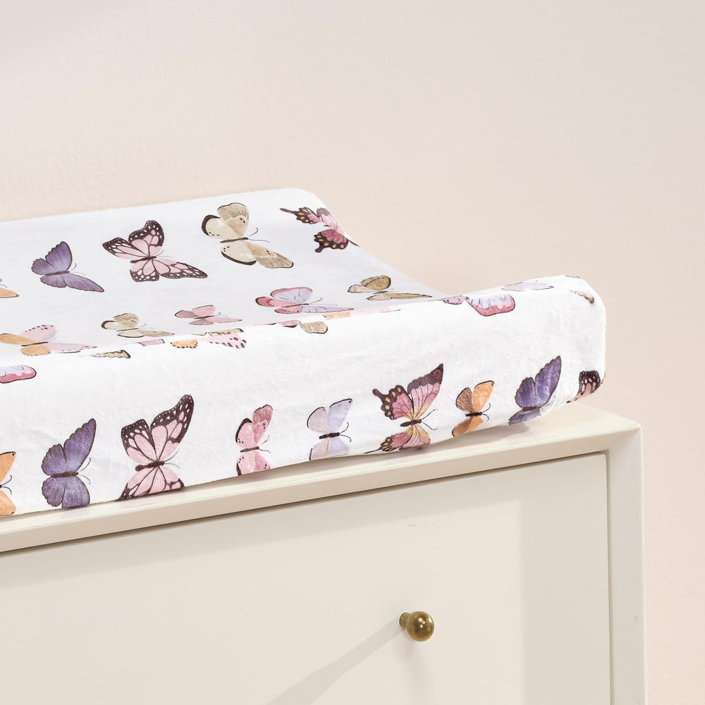 Lambs & Ivy Butterfly Dreams white ground with colorful butterflies adds soothing style.