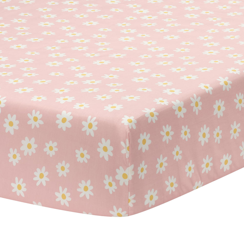Lambs & Ivy Daisy Dreams breathable cotton sheet in crib for comfortable sleep.