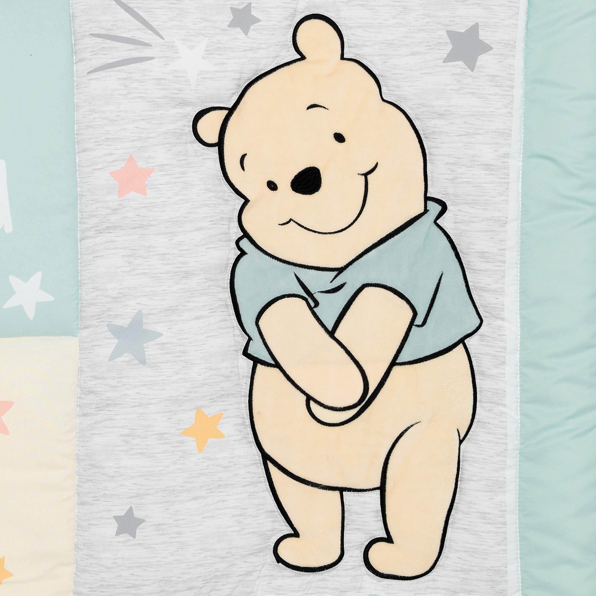 Lambs & Ivy Disney Baby Winnie the Pooh Hugs set creates a serene pastel theme
