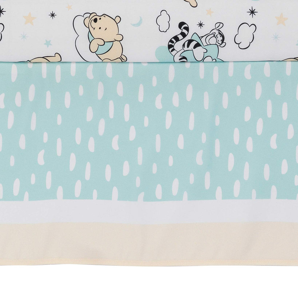 Lambs & Ivy Piglet pattern brings gentle color and whimsy to the crib