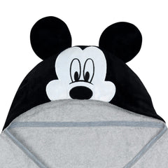 Lambs & Ivy Mickey towel on baby demonstrates absorbent cotton terrycloth after bath.