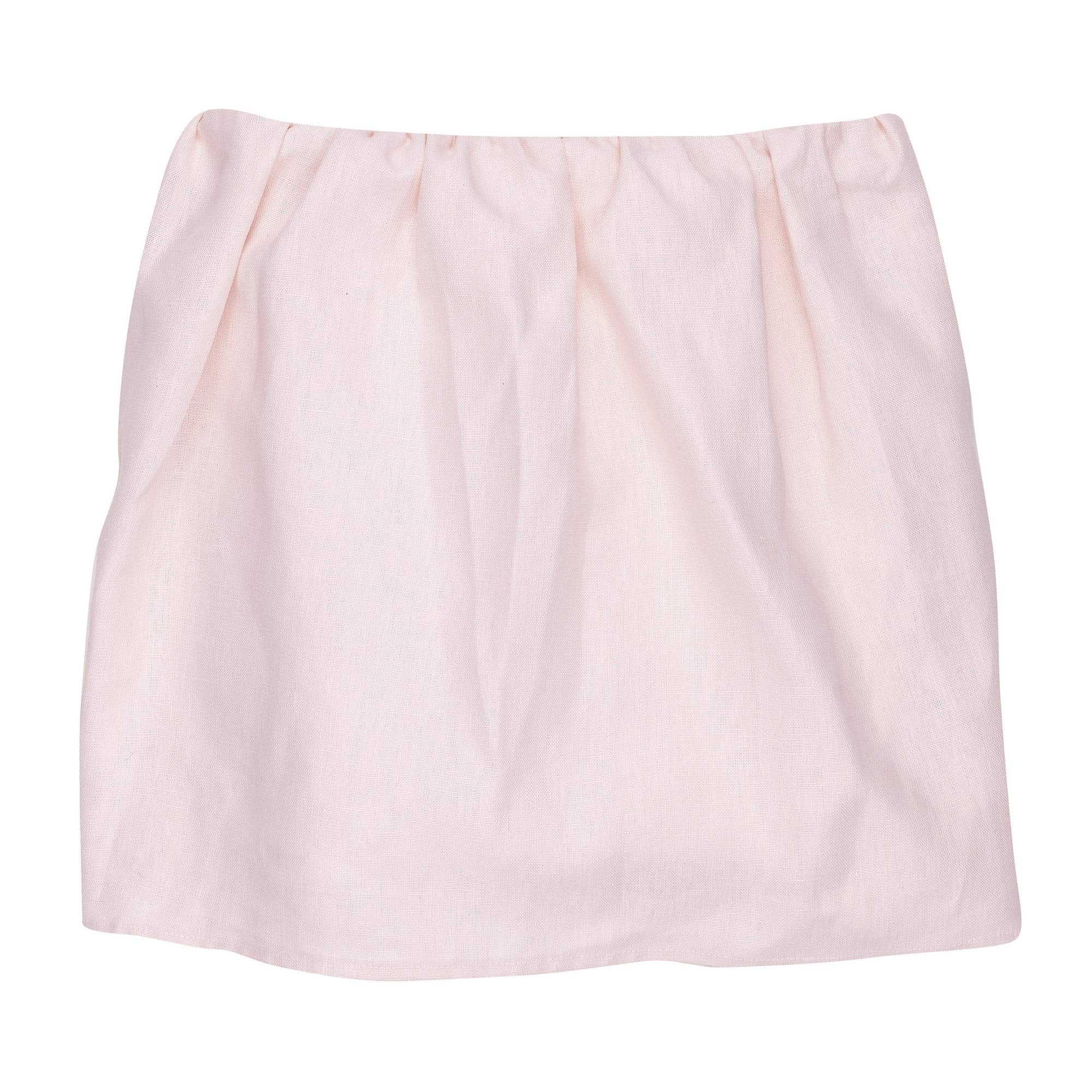 Lambs & Ivy Floral Garden pink linen crib skirt, front view, coordinates with serene nursery decor.