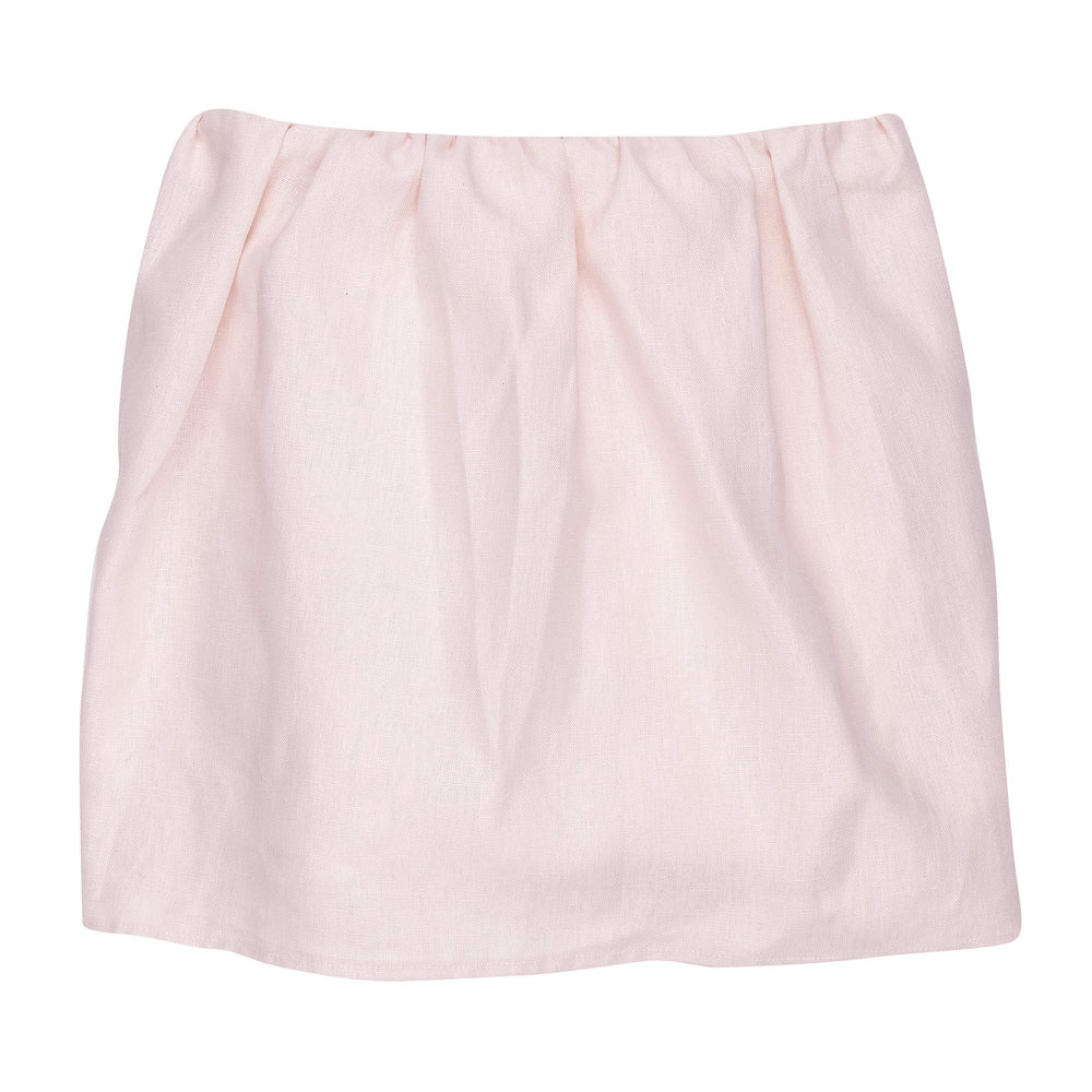 Lambs & Ivy Floral Garden pink linen crib skirt, front view, coordinates with serene nursery decor.