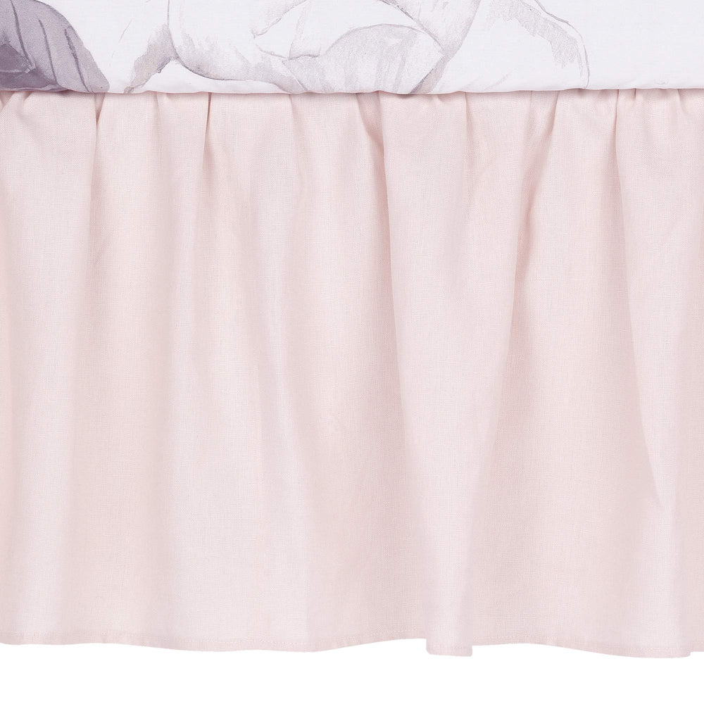 Lambs & Ivy Floral Garden pink linen crib skirt, side view, easy post fitting.