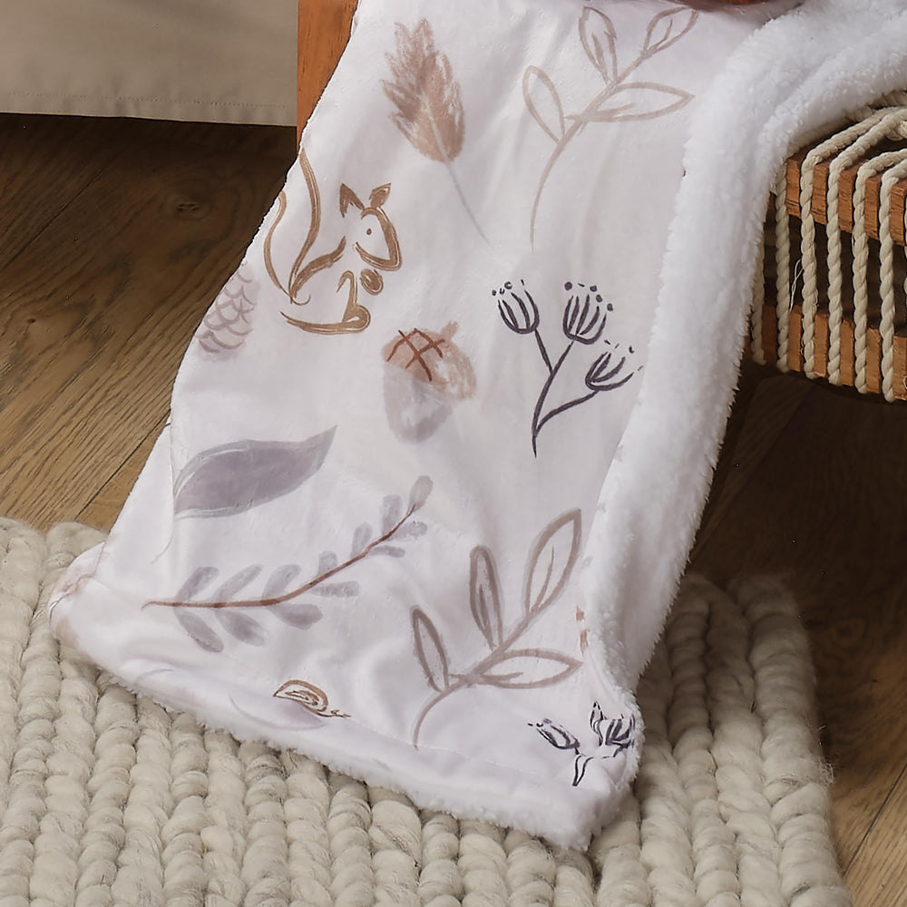 Lambs & Ivy forest scene detail offers whimsical wildlife for baby's nap time.