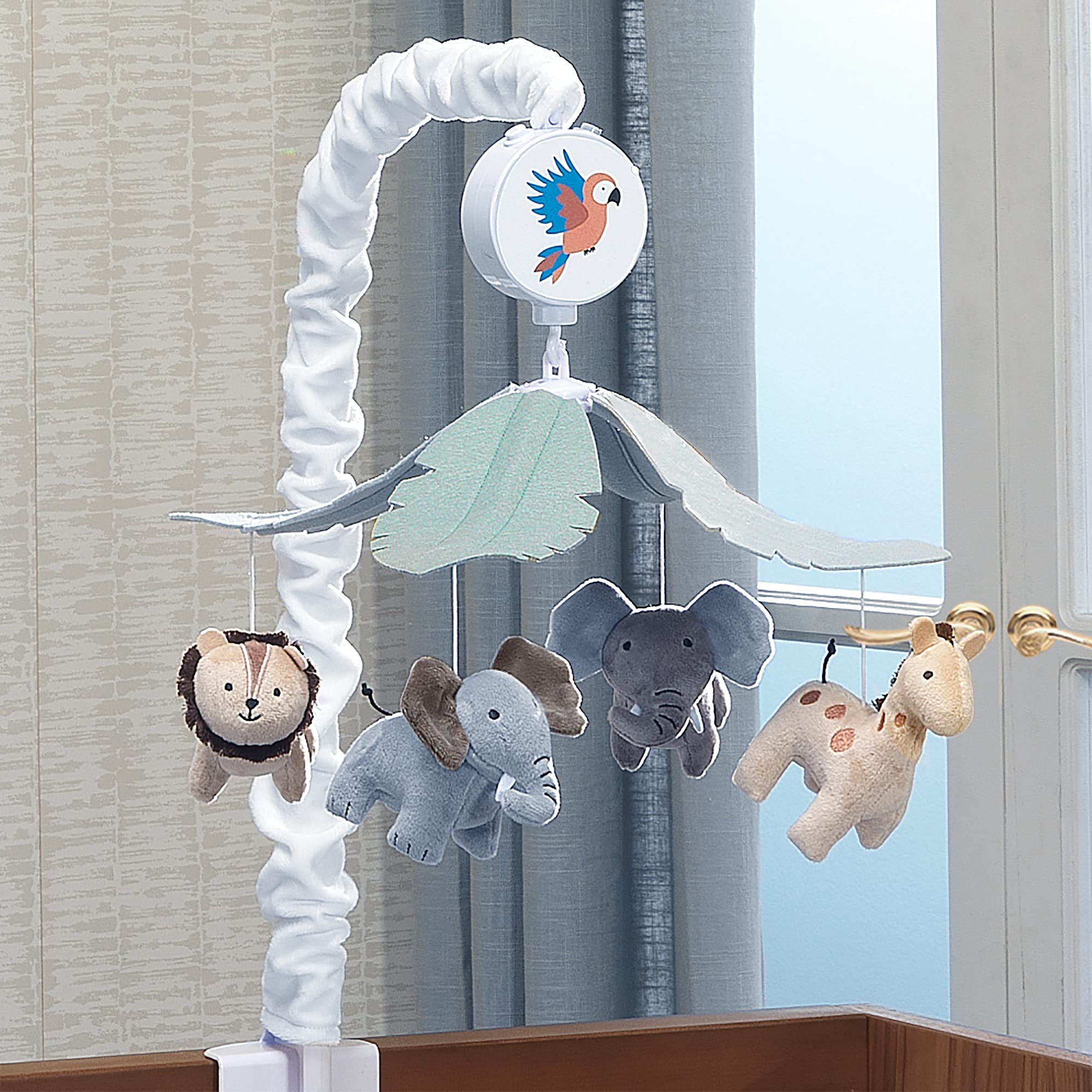 Lambs & Ivy Jungle Friends mobile features soft animal figures for bedtime calm.