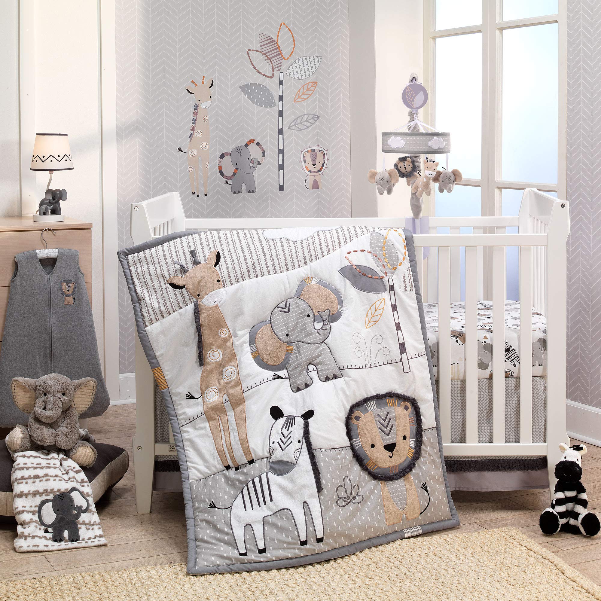 Lambs & Ivy Jungle Safari quilt with dim trims adds cozy visual detail.