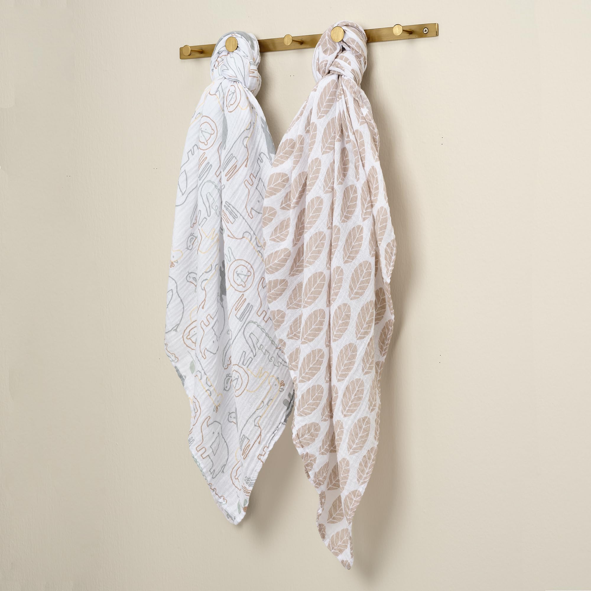 Lambs & Ivy Jungle Story folded swaddle set in nursery