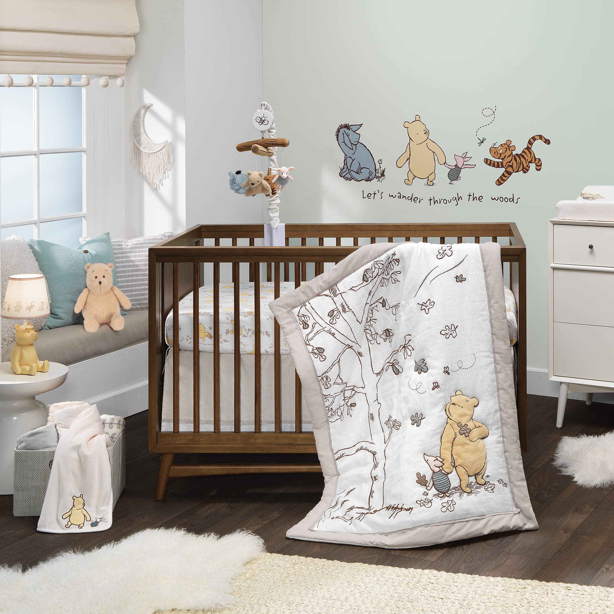 Baby using Lambs & Ivy Pooh mobile to self-soothe during quiet time