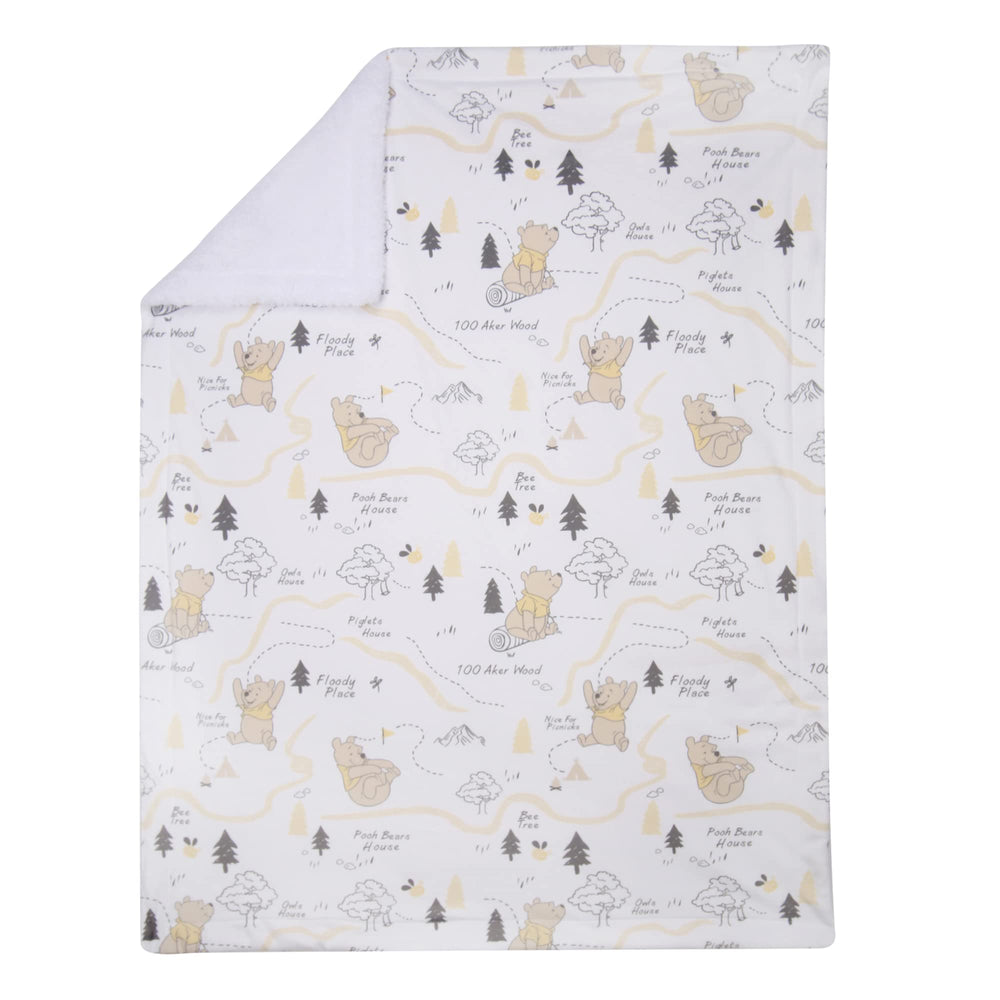 Lambs & Ivy Pooh blanket—back faux shearling white for cozy on-the-go snuggles.