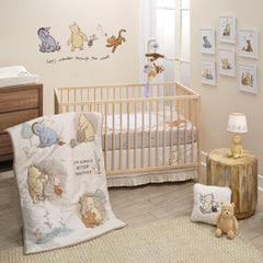 Lambs & Ivy Pooh Bear and Pals quilt close-up showing cozy cotton texture for tummy time.