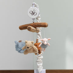 Soft visual and auditory stimulation from Pooh characters on Lambs & Ivy mobile
