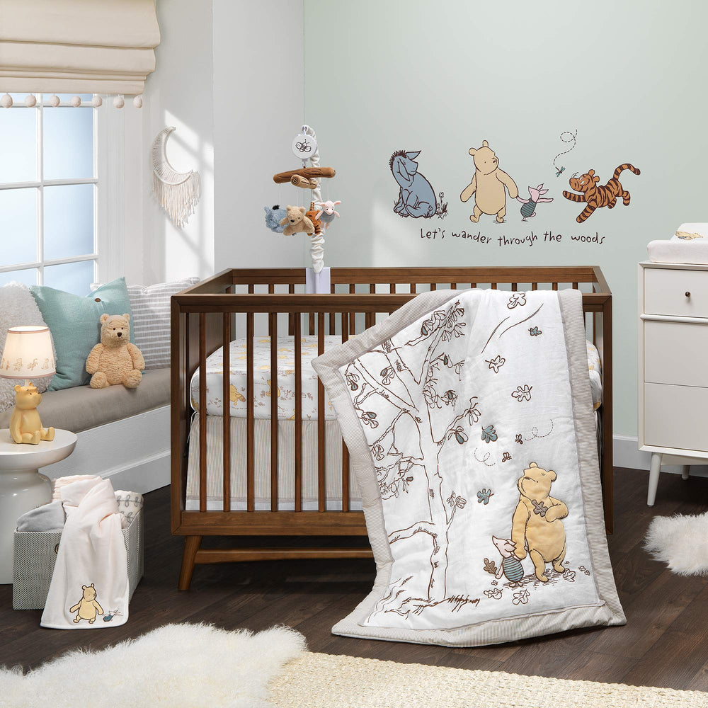 Volume control and on/off switch on Lambs & Ivy Pooh mobile for customizable listening