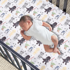 Lambs & Ivy Star Wars sheet featuring R2-D2 and stormtroopers for playful toddler room