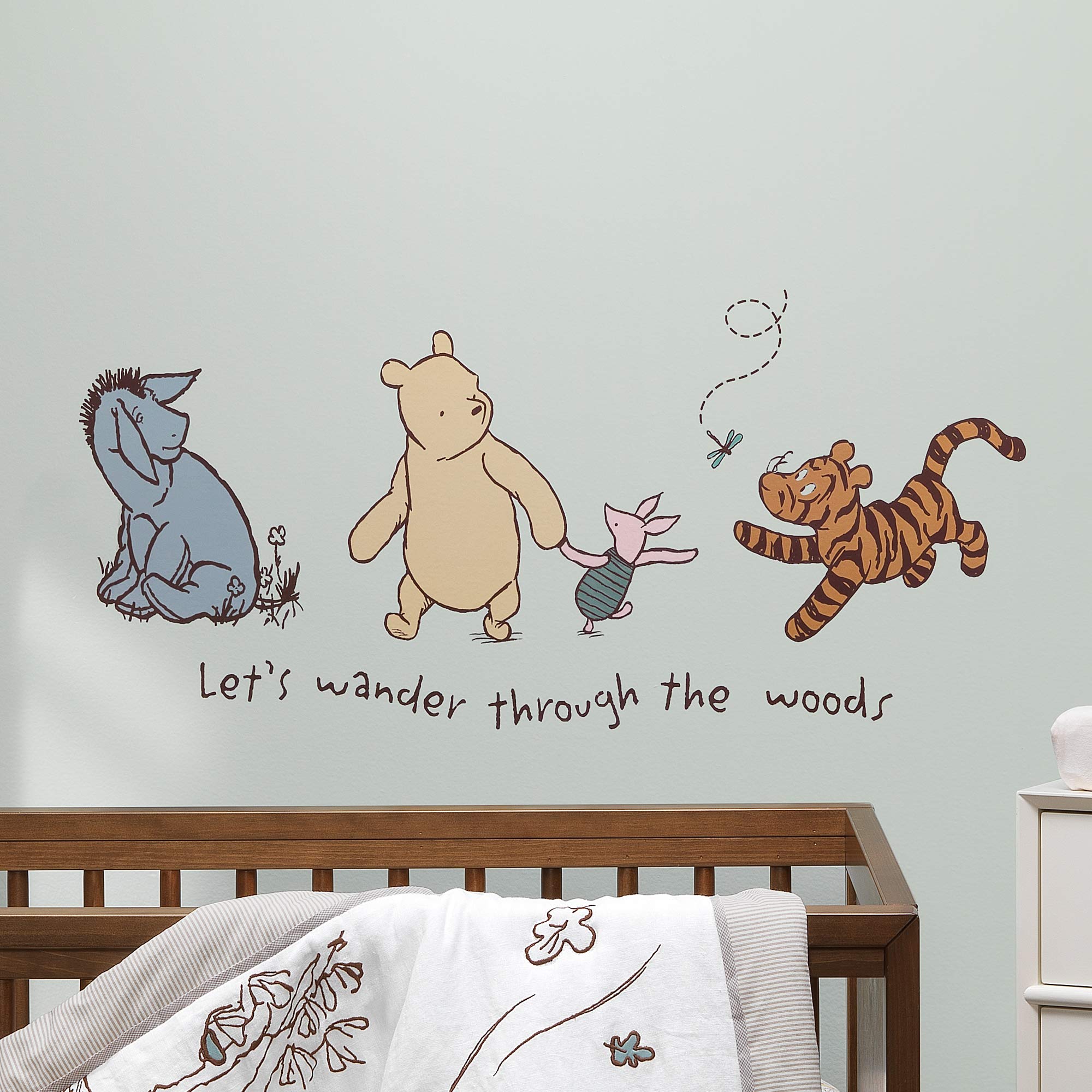 Pooh decals with dragonfly and decorative verbiage for a charming wall scene.