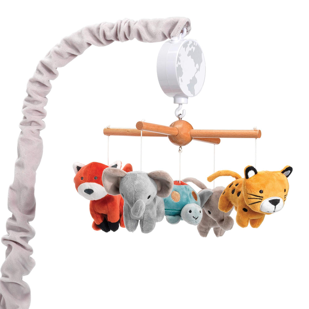 Lambs & Ivy Wild Life mobile over crib; soothing lullabies for bedtime.
