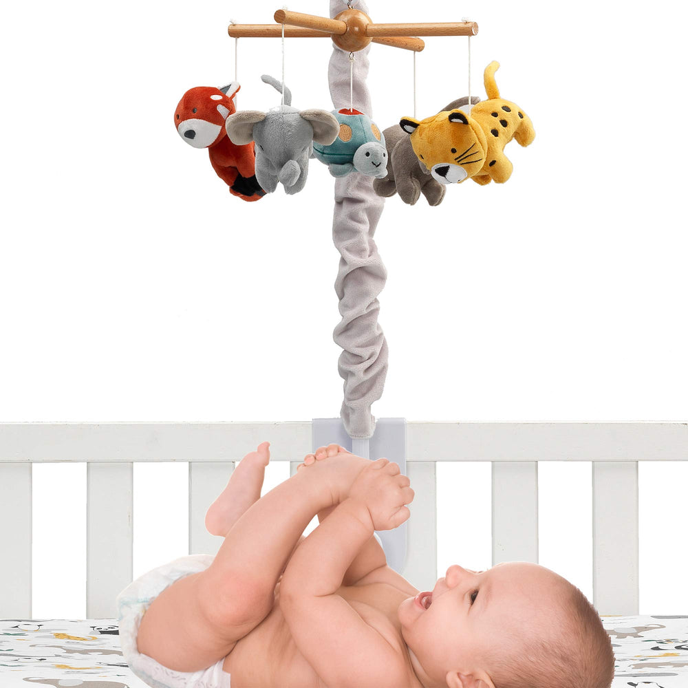 Rotating Lambs & Ivy Wild Life plush animals for visual engagement.