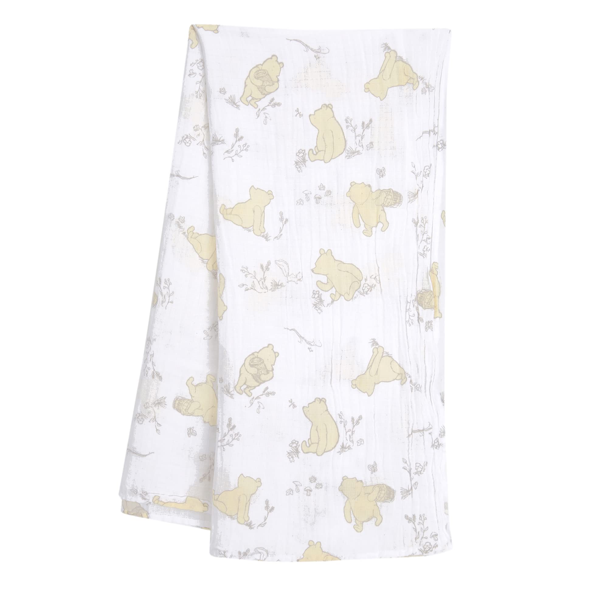 Lambs and Ivy Winnie the Pooh swaddle fabric close up shows breathable muslin texture.