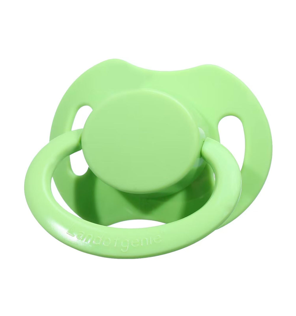 Bone-shaped pacifier design with green shield and logo.
