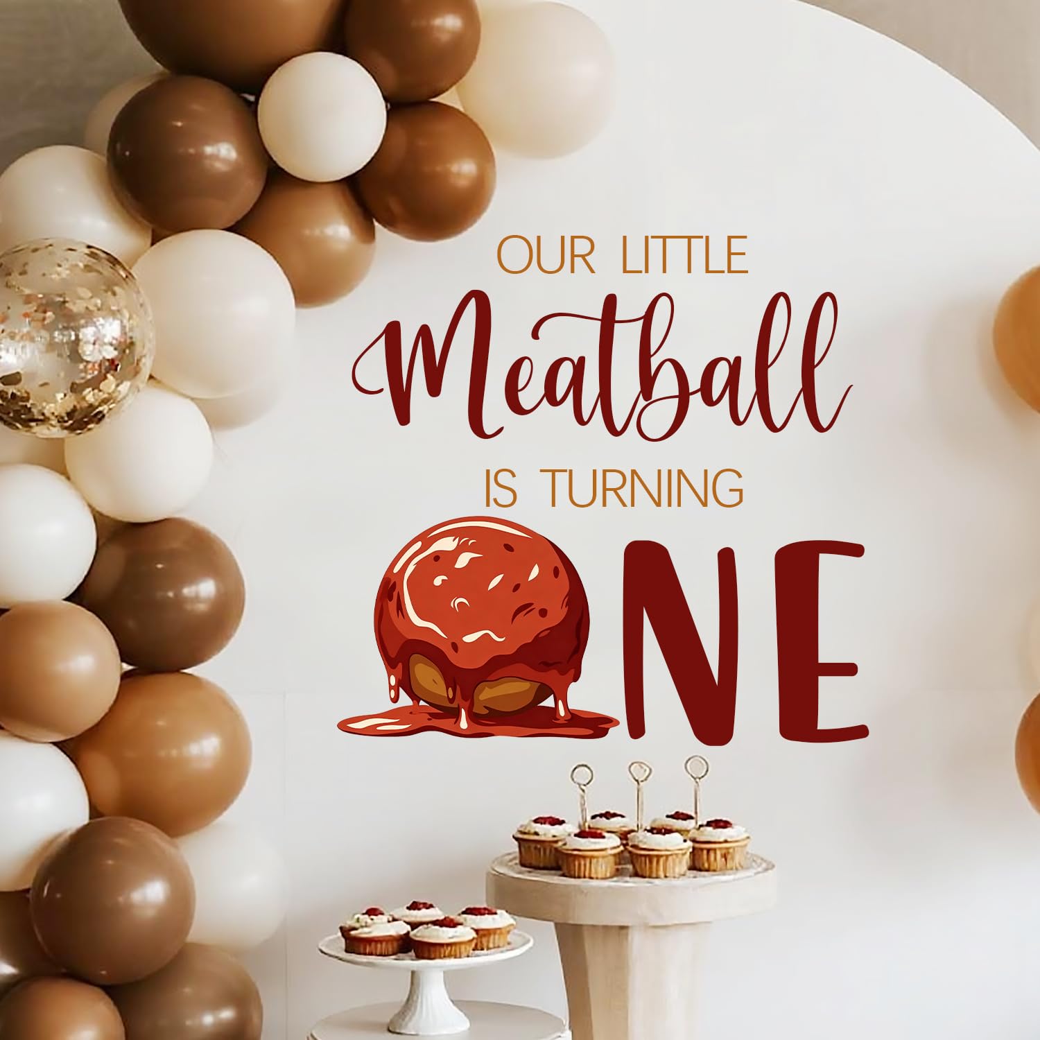 LANKBACK Our Little Meatball Turning One decal provides a festive backdrop for photos.