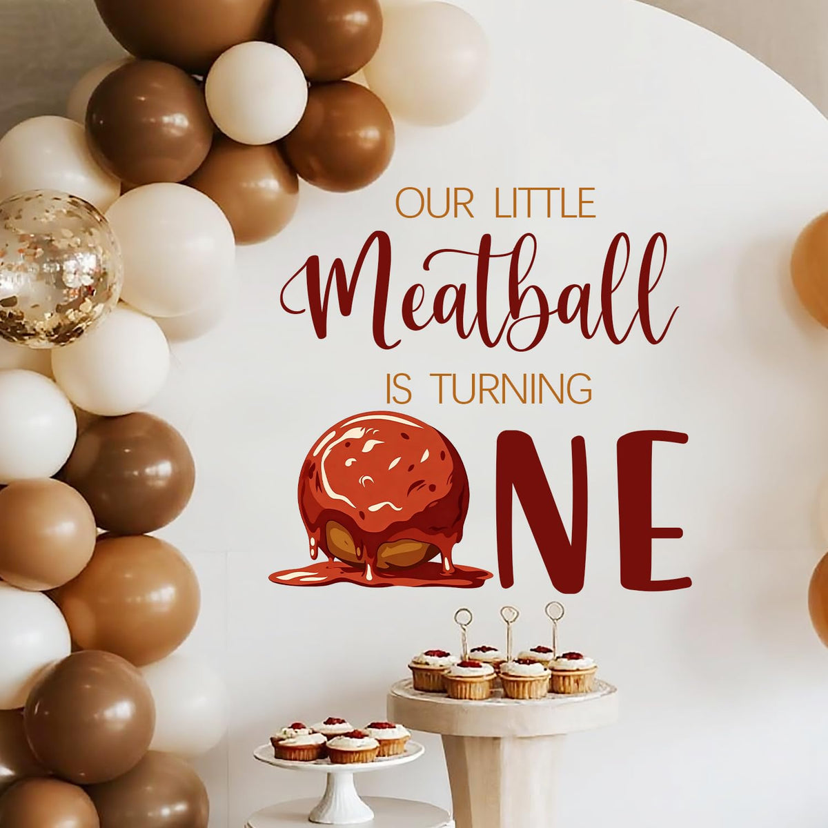 LANKBACK Our Little Meatball Turning One decal provides a festive backdrop for photos.