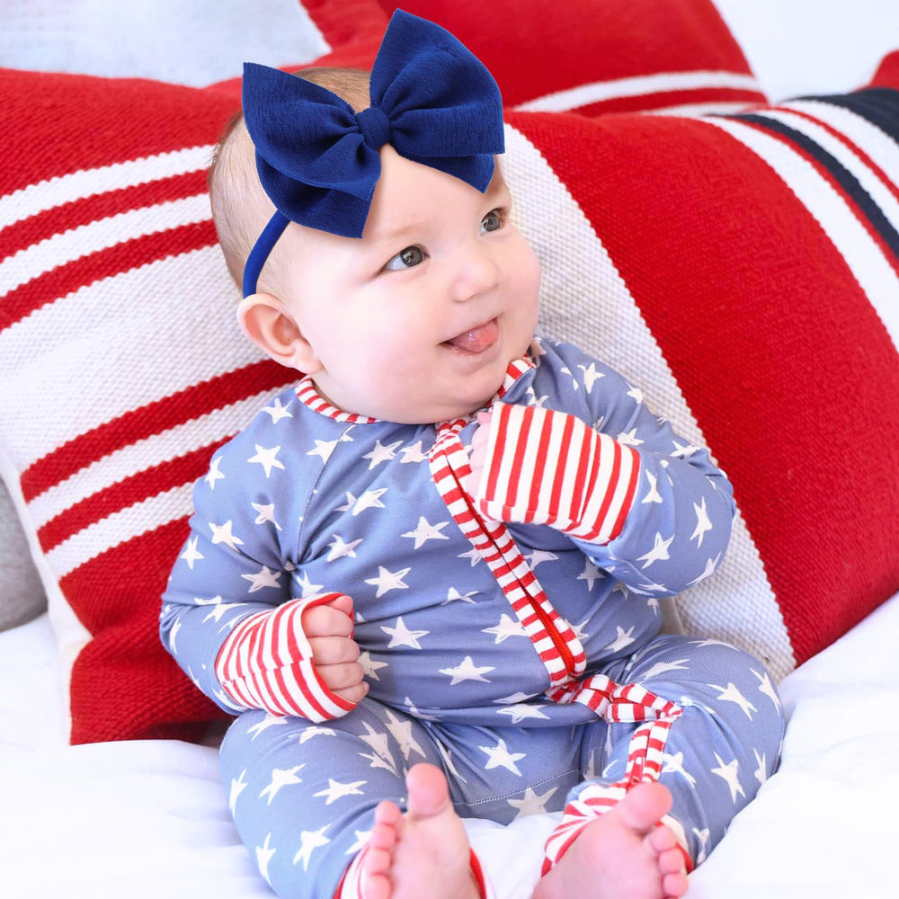 Lanmerry blue headband bow adds playful patriotic flair to photos.
